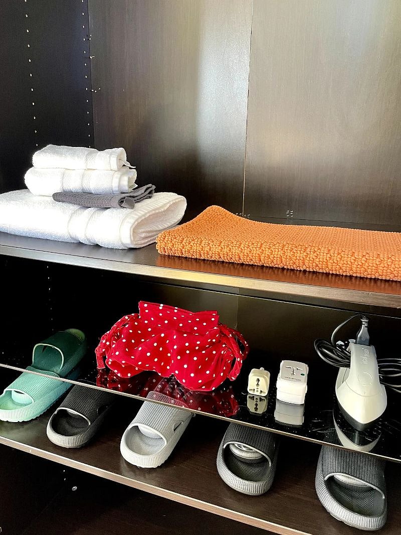 Fresh hotel towels, makeup cloth, bathmat, hair dryer, steamer, international adaptors and indoor slippers that feel like clouds!