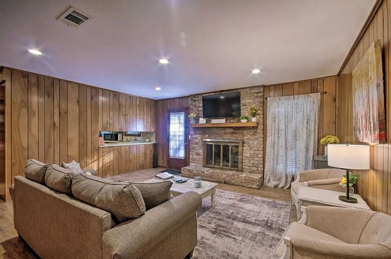 Family room with wall mounted 55-inch TV.