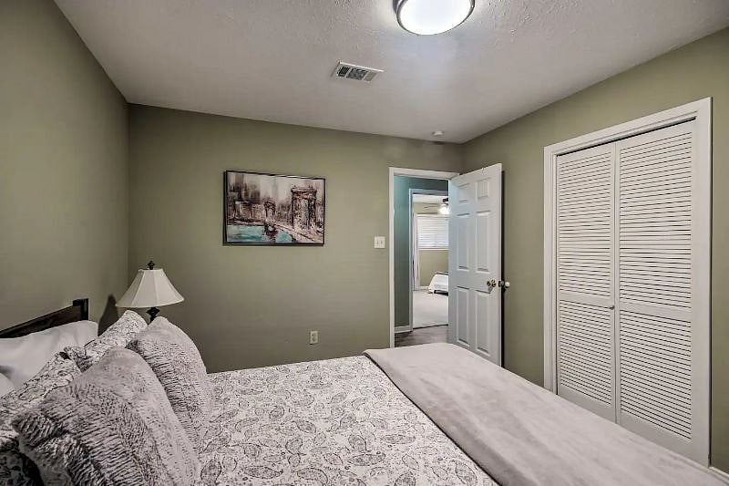 3rd bedroom with queen bed dresser plus plenty of closet space.