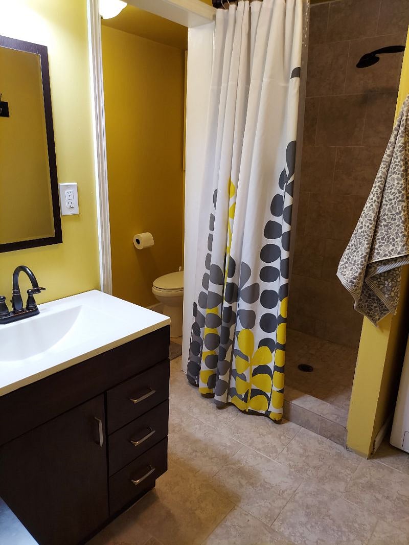 The Bathroom Step-In Shower Wall.