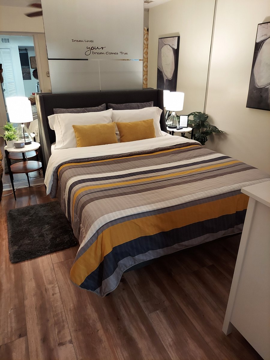 The Bedroom with queen bed and nightstands.
