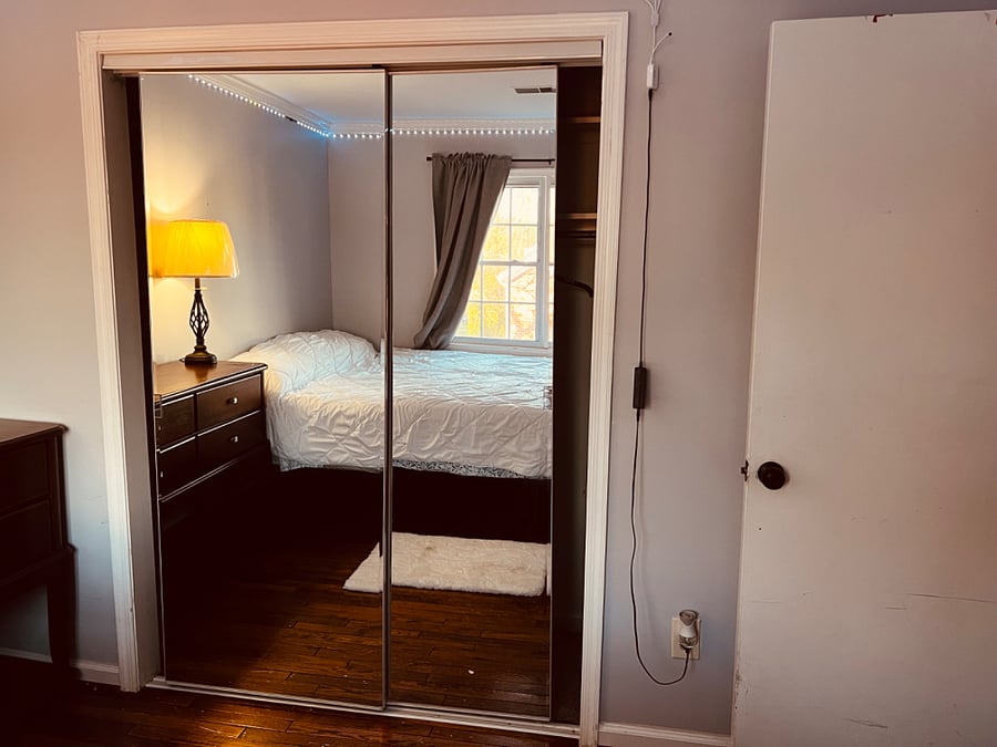 Second bedroom with King sized bed and large mirrored closet. Plenty of storage