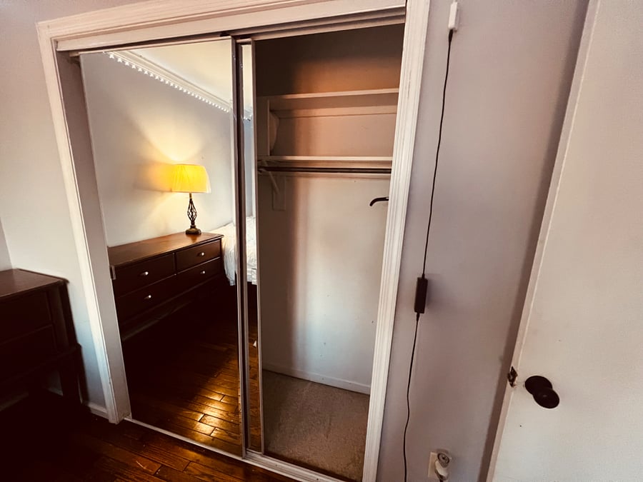 Second bedroom with King sized bed and large mirrored closet. Plenty of storage