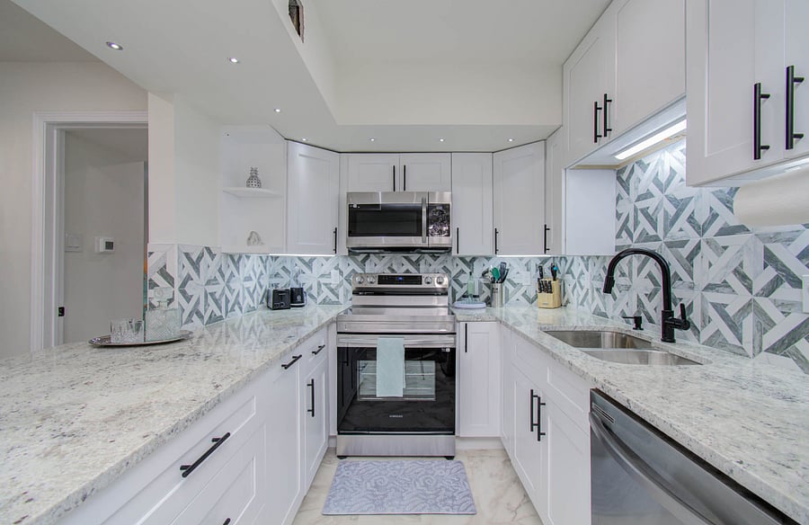 Fully equipped kitchen with brand new stainless steel appliances, coffee maker, blender, toaster, kettle