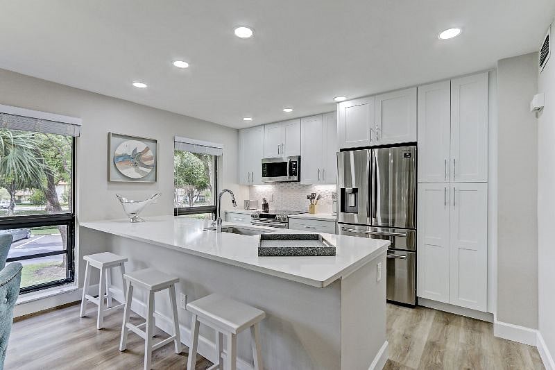 Quartz Countertops throughout.  Stainless Steel New Appliances. 