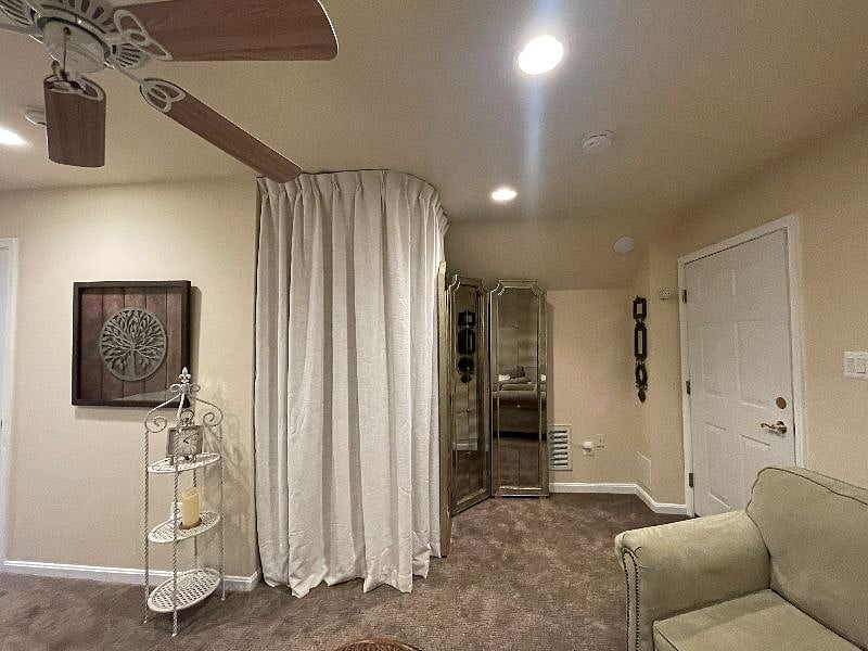 Washer, Dryer and Cleaning supplies behind the curtain.