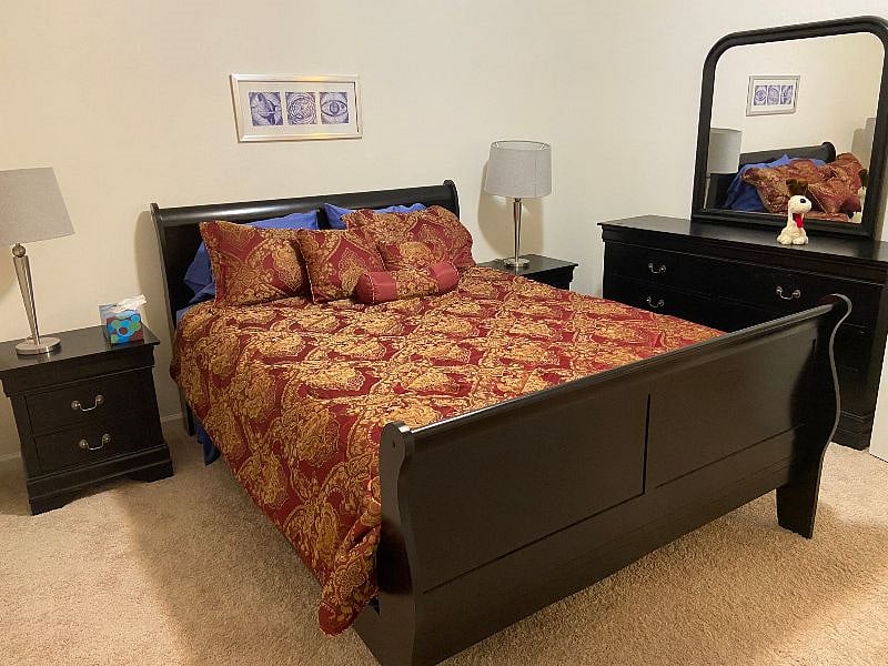 Bedroom with Queen Bed and dresser.