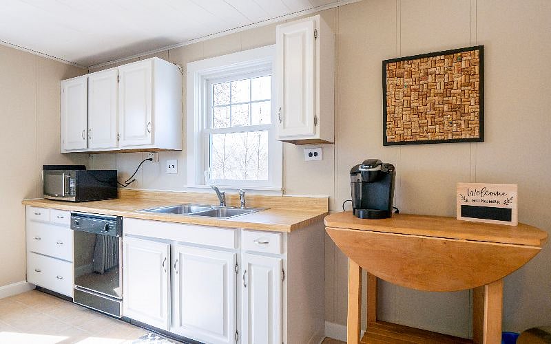 Kitchen with dishwasher and microwave