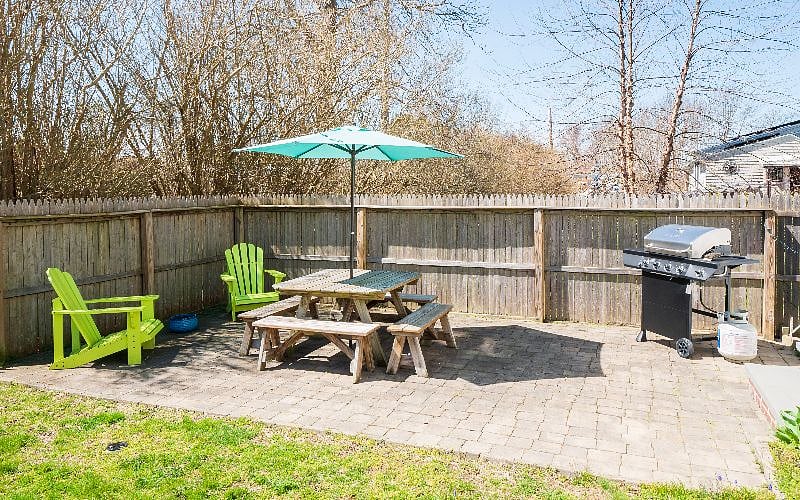 Side patio area with gas grill