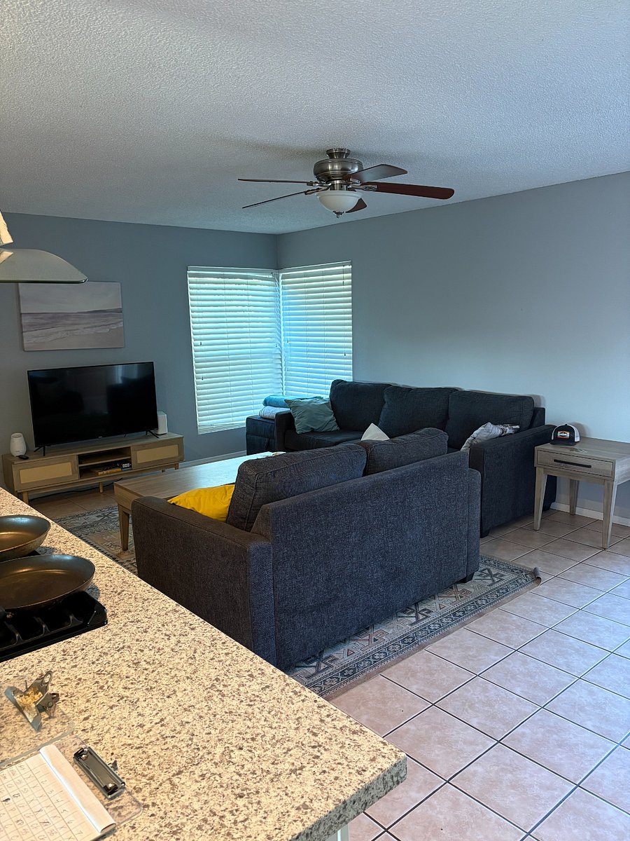 Full couch plus loveseat with coffee table and corner table.