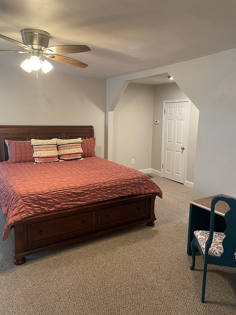 Comfortable king bed in extra large room with 2 closets. One lined with cider. Desk and chair for working space.