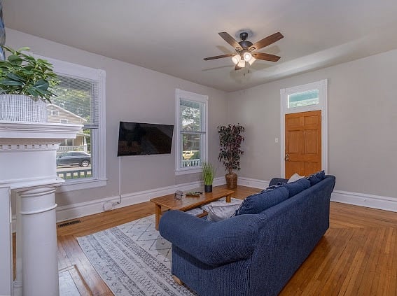 Living area with smart TV and beautiful hardwood floors