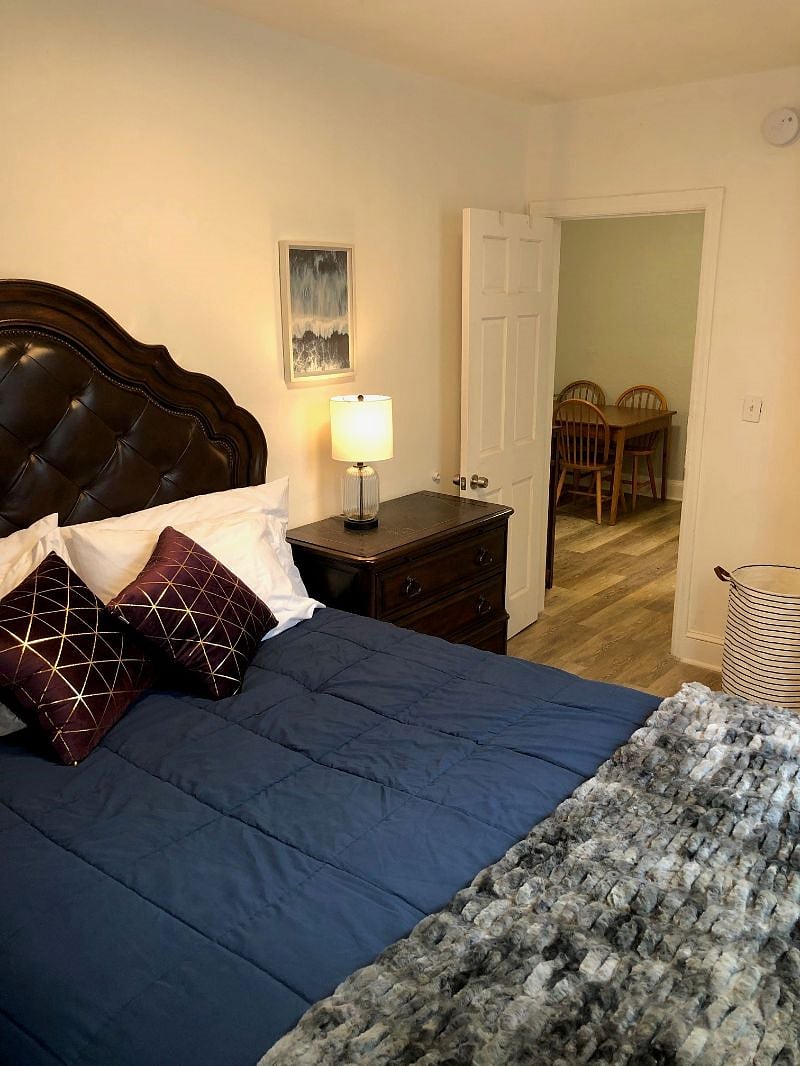 Comfortable second bedroom with ample closest storage and dresser drawers.