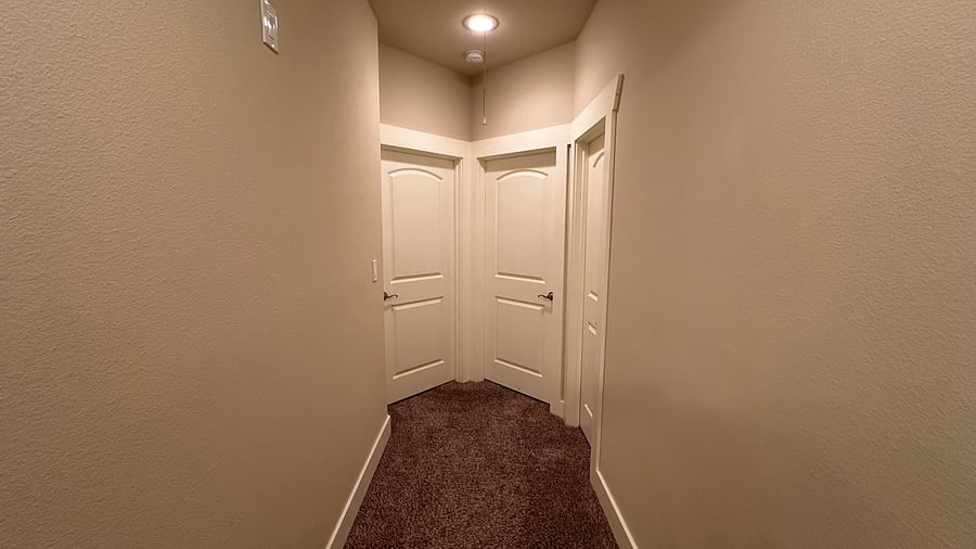 Hallway to 2 bedrooms. Each with their own bathroom