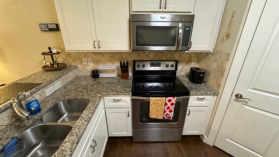 Kitchen with microwave & oven.