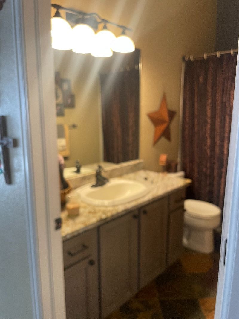 Bathroom with tub as well as shower.