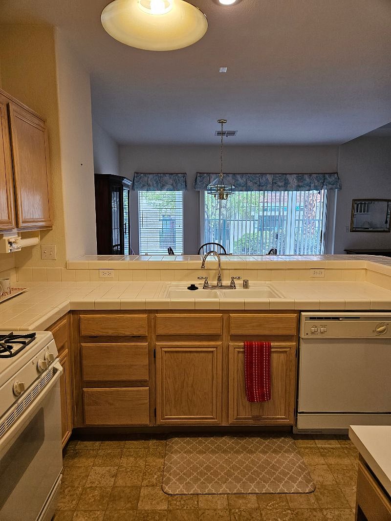 Kitchen looking to dining room and patio