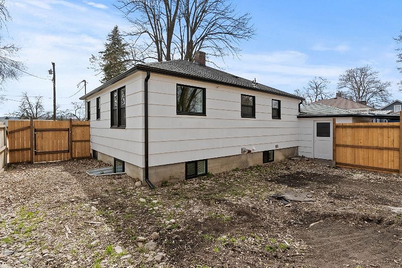 Fenced backyard accessed through attached garage