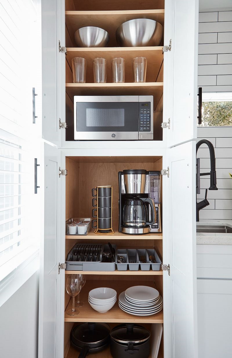 Microwave, coffee maker, kitchenware. 