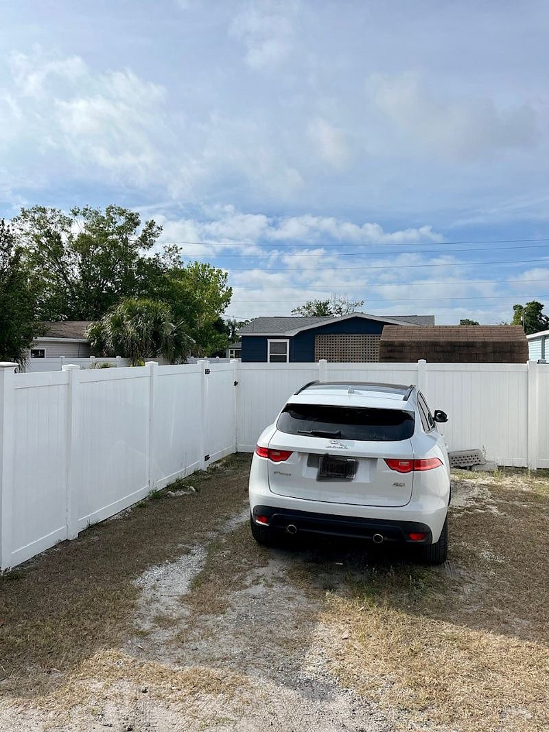 Private parking pad next to back gate.