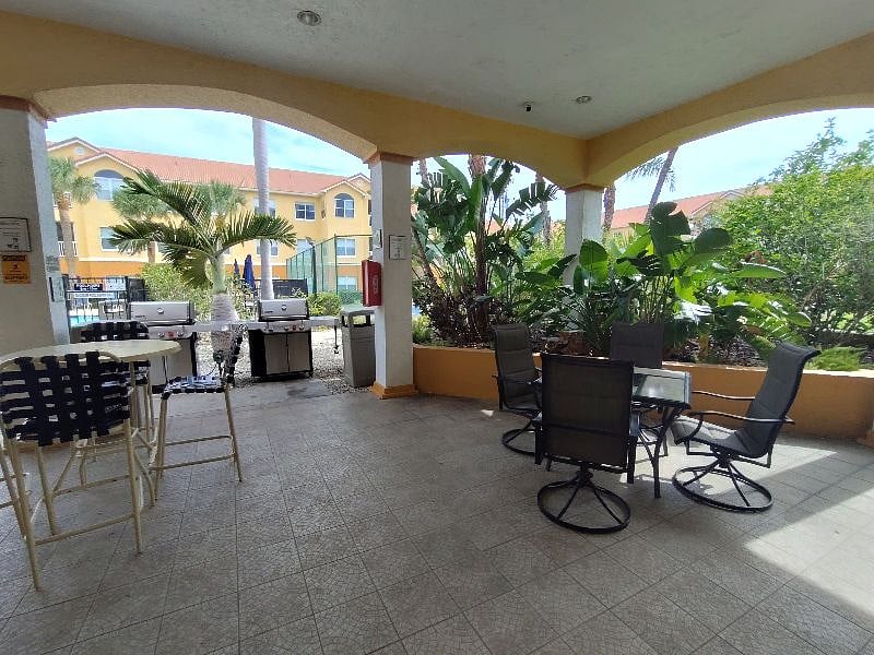 Covered patio next to BBQ grills