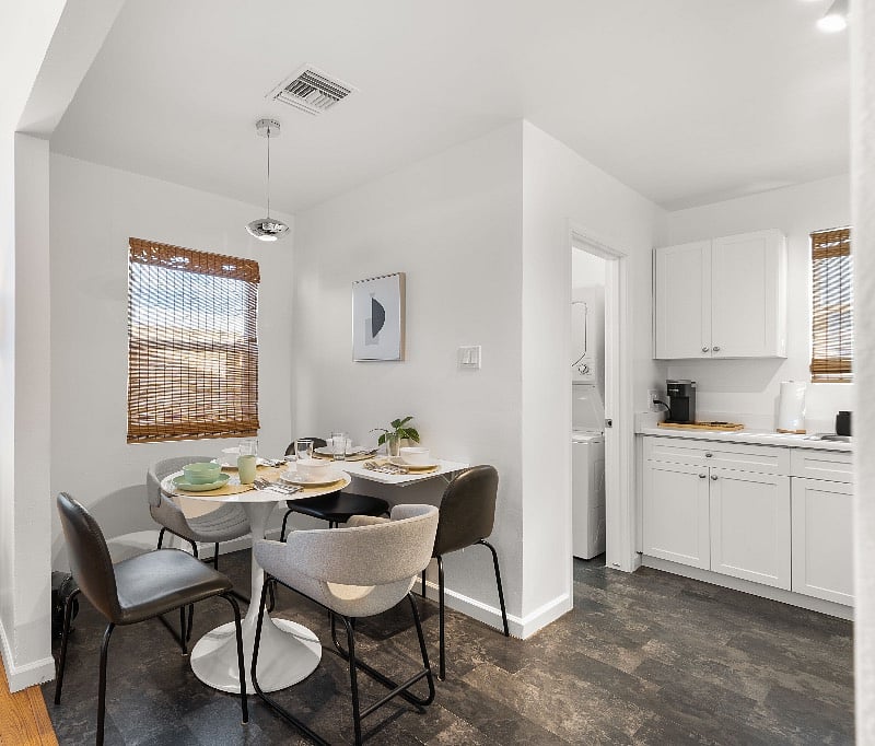 Mid-century modern style white round tulip table, with optional additional wall mounted table, comfortably seats five. Table leaf can also be used as an additional desk/work space or lowered down out of the way to seat less people. Service for 5+ includes unbreakable matching kids plates, bowls, spoons and forks.