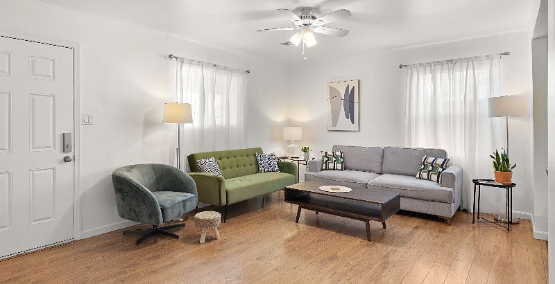 Ample comfortable seating for five plus. Green couch pulls out into a bed for a child or for lazy afternoon naps.