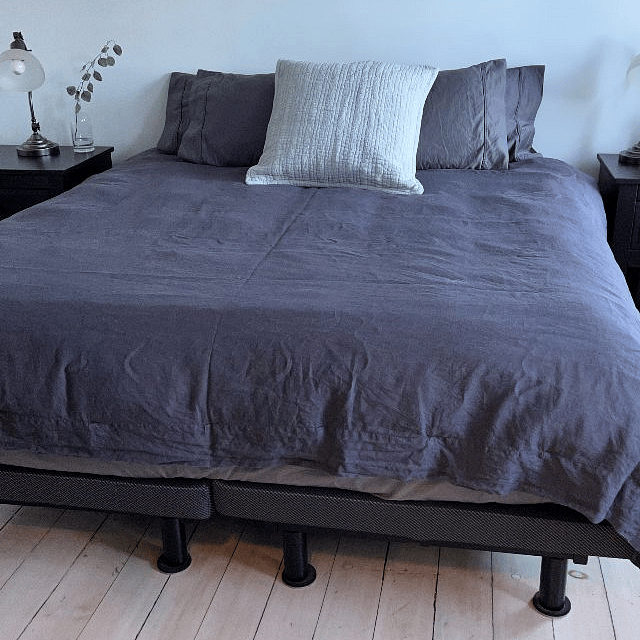 Comfortable queen bed  with reading lamps on each side