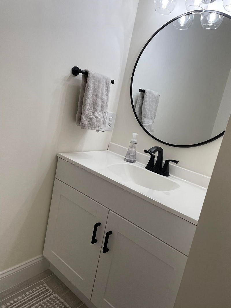 Vanity and mirror and sink area