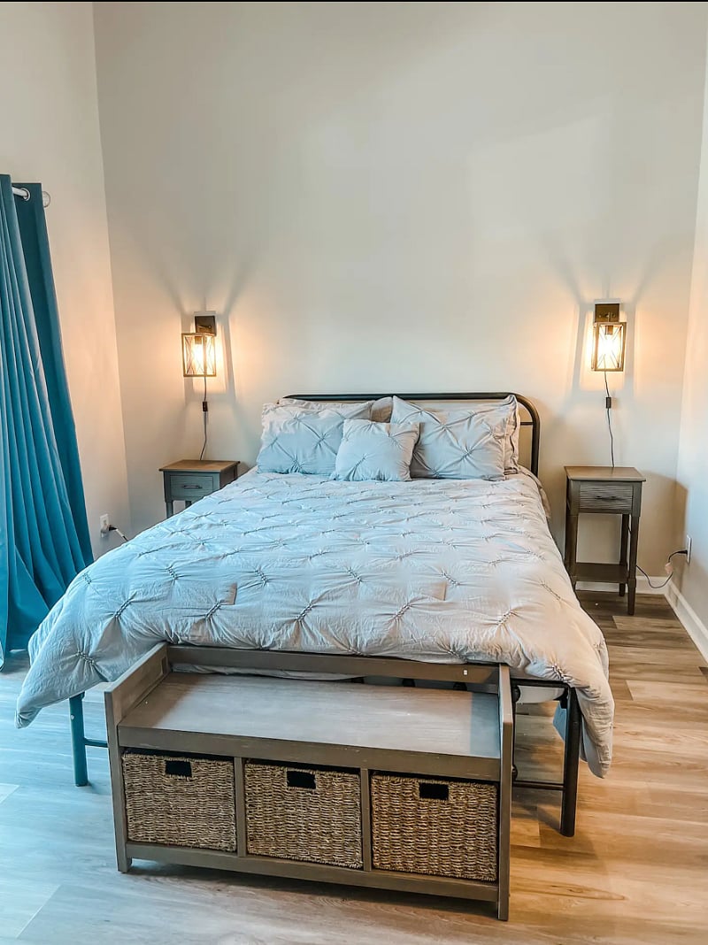 First floor primary bed room featuring a queen size bed. Mattress is medium/firm.