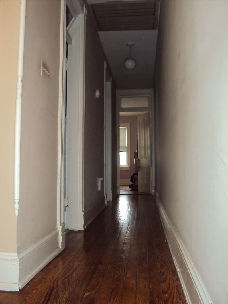 Tenant bedroom at end of hall, overlooking garden