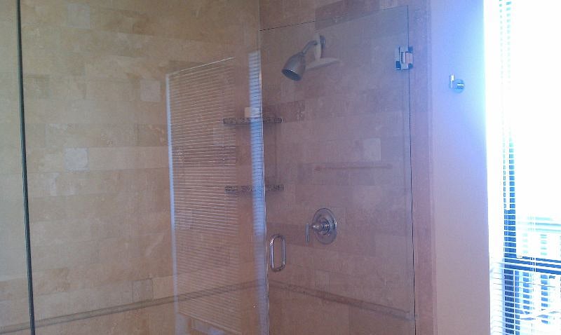 frameless shower with bench and soaking tub in master. Private toilet and hill country views!