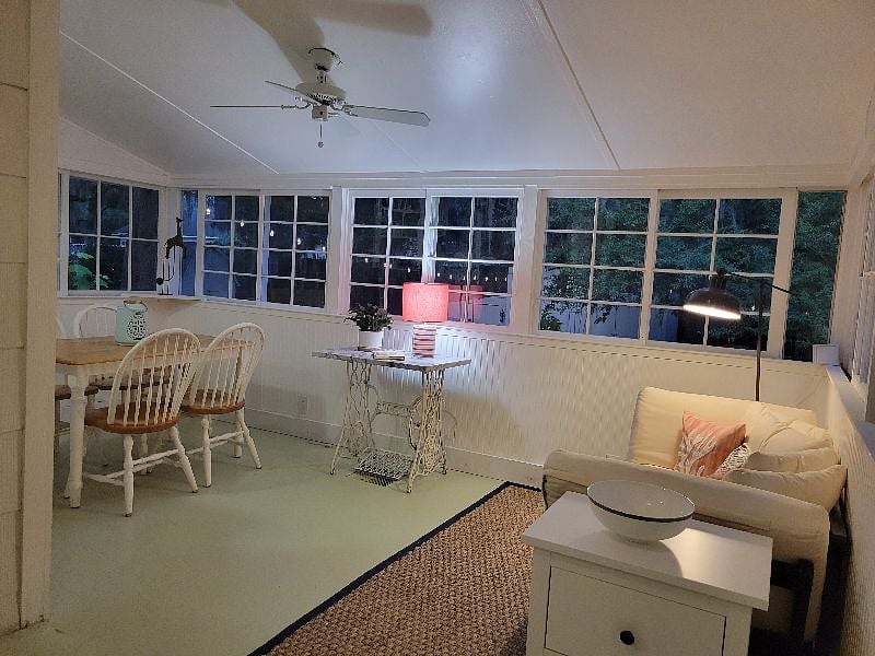 Dining table and sitting area overlooking backyard