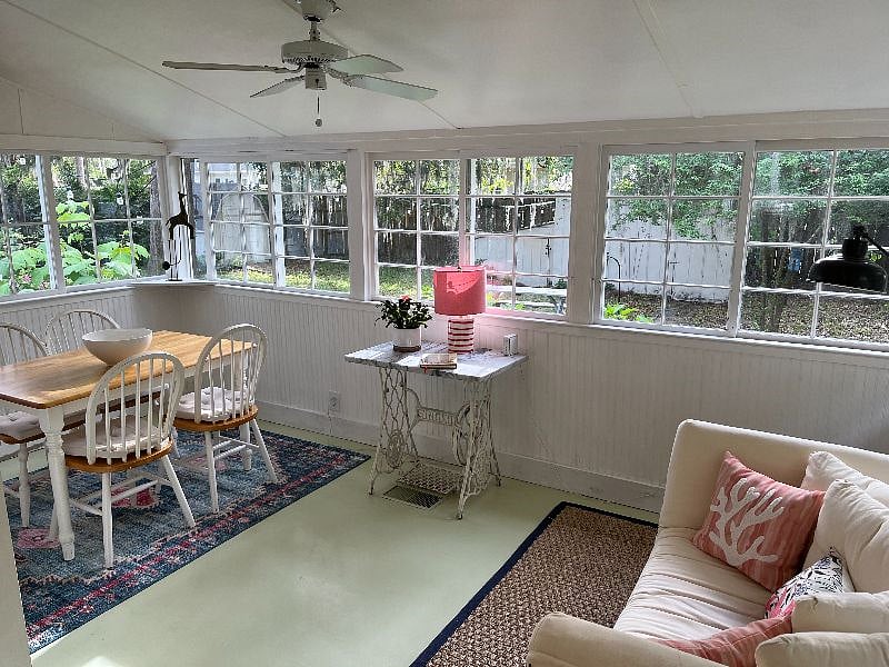 Dining table and sitting area overlooking backyard