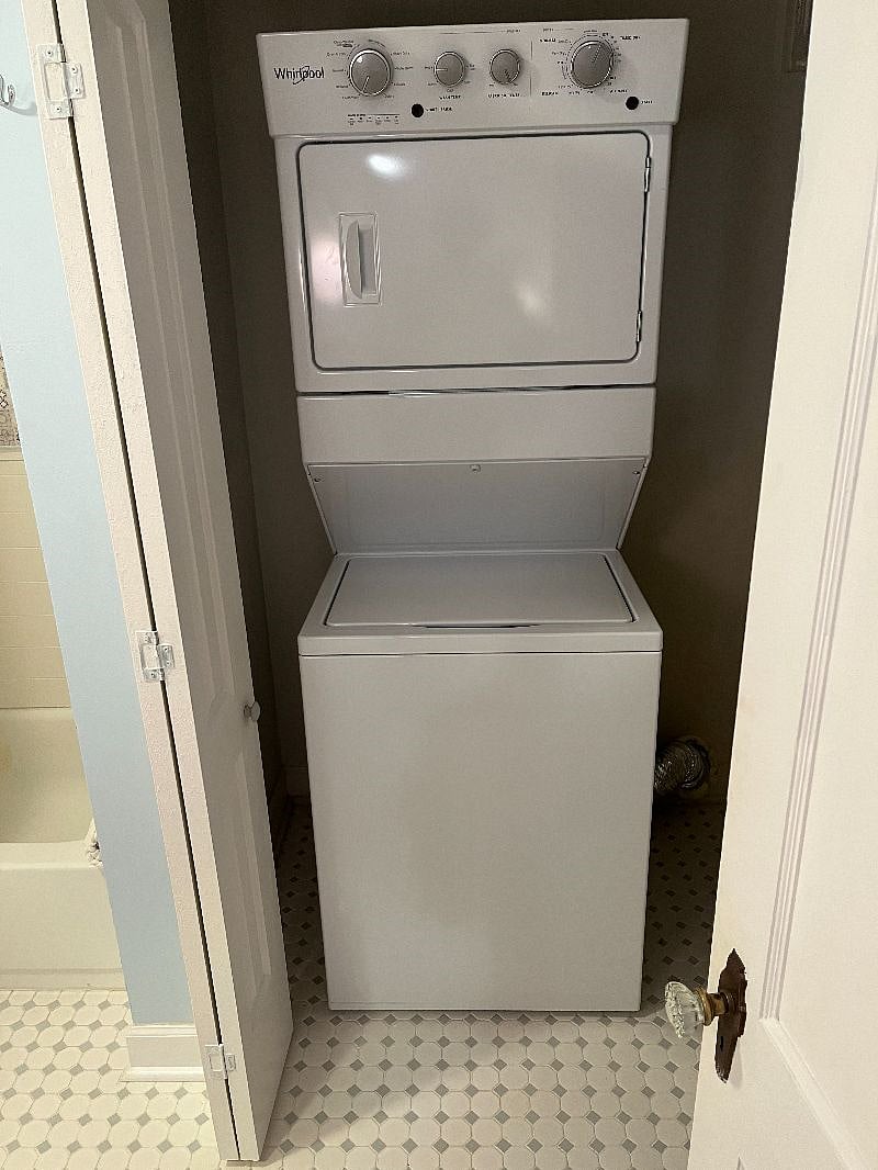 Laundry unit in master bathroom closet
