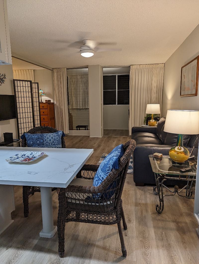 entrance to the enclosed lanai outside living room with dining table