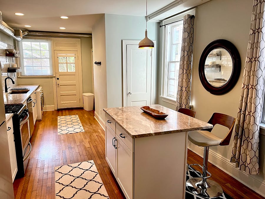 Dining area leading into full kitchen