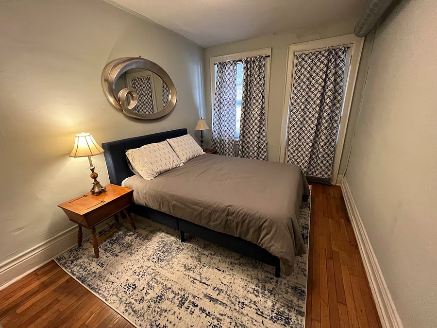 Bedroom with door leading to patio