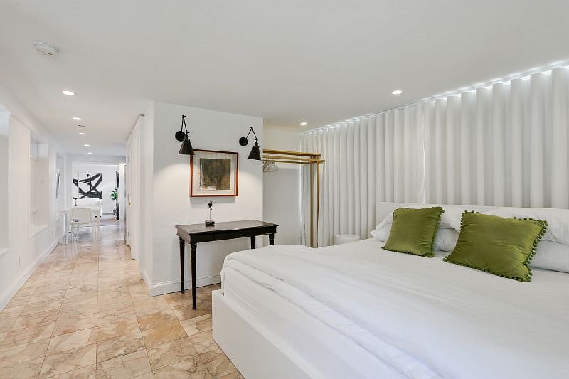 Note that there is no door separating the bedroom and the rest of the space.
