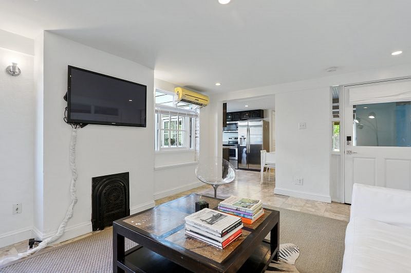 The living room connects to the kitchen.