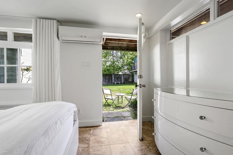 The bedroom leads to a covered patio where you'll find rocking chairs and a hammock chair.