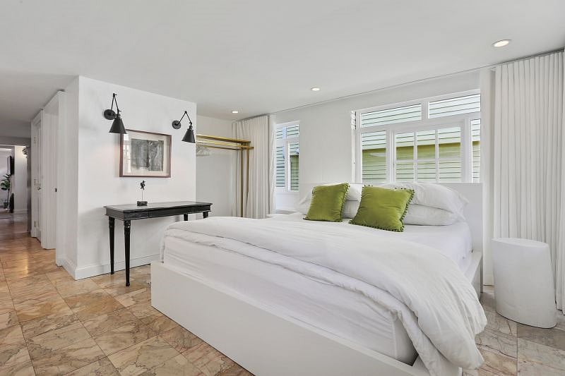 In the bedroom, you'll find a writing desk, a memory-foam, king-sized bed with underbed storage, a hotel-style clothes-hanging system, and a dresser.