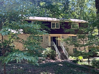 The newly painted and renovated home at the end of the cul de sac, on the edge of acres of woods.