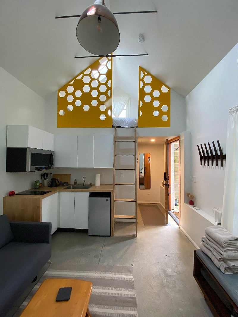 Interior view looking toward entry, kitchenette and sleeping loft