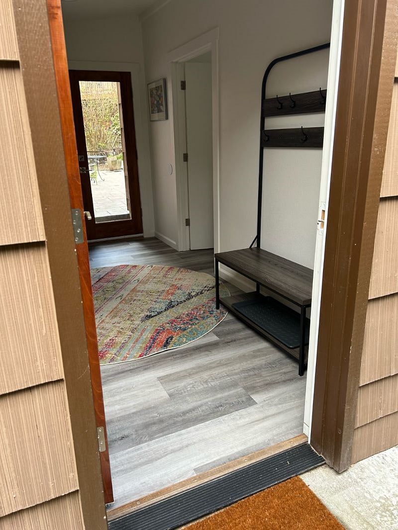 Entry door to the studio into the entrance room; door in back leads to our backyard and garden.