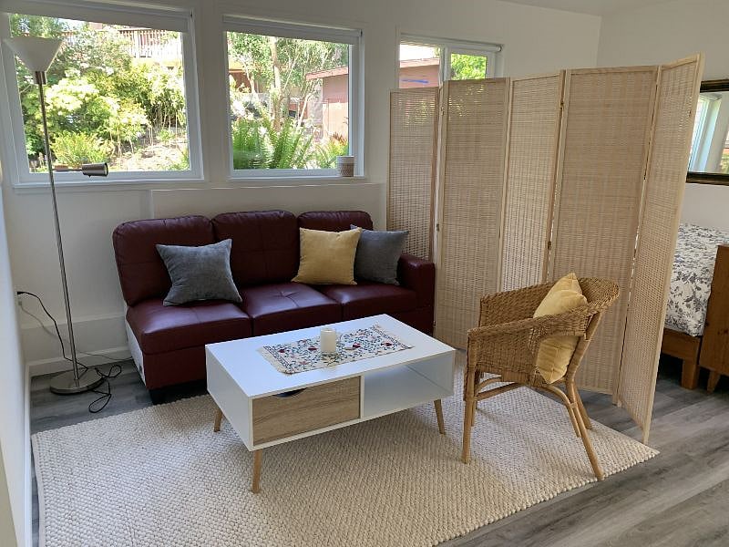 Seating area with couch and chair.