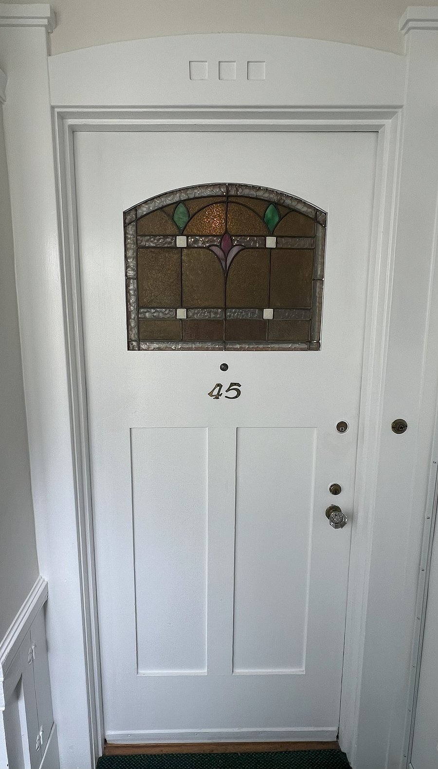 Door to apartment, Arts & Crafts details