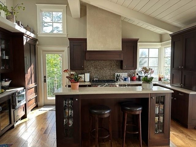 Door leads to upper and lower side decks. Sub-Zero refrigerator and Bosch dishwasher. All glass storage containers and non PFA kitchen utensils.