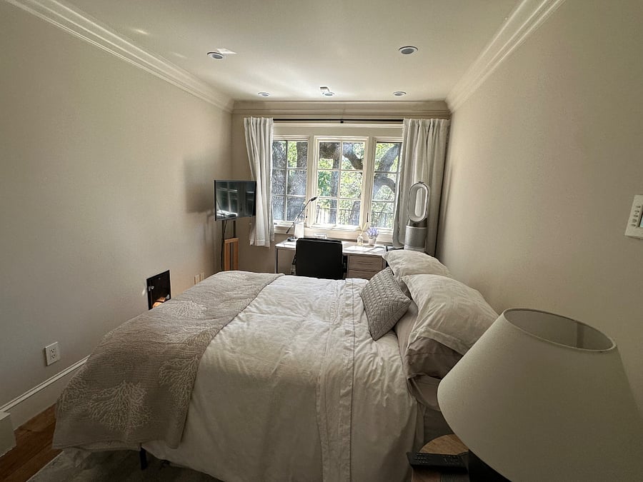 Bedroom with view with both sheer and black-out shades.