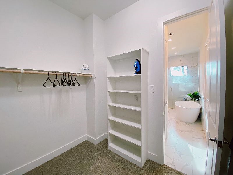 The Primary Suite includes a large walk-in closet.